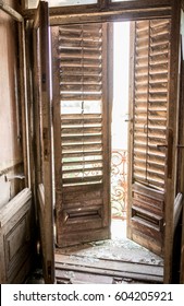 Old door with blinds - Shutterstock ID 604205921