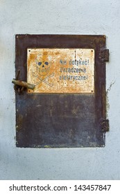 Old Door Of Electric Meter With Warning, Poland.