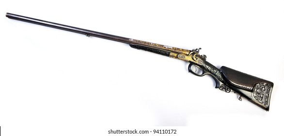 old double-barrelled side by side hunting gun 12 caliber (Bavaria, Munich. XIX century) isolated on white background.