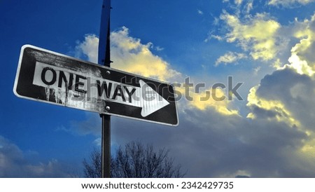 Old drippy oneway sign and clouds