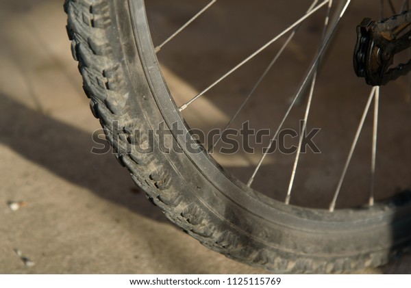 An old, dusty bicycle\
tire