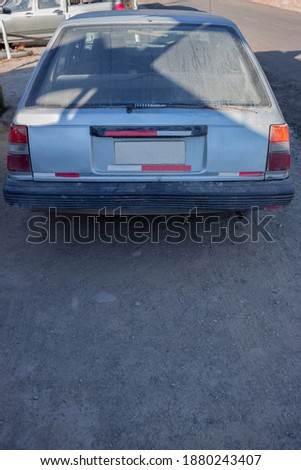 
old dusty car rear view