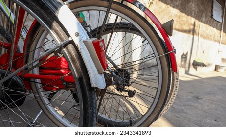 An old Dutch bicycle that is still well-maintained and usable. Old bicycle tires of a parked bicycle. Roadster bicycle, Camel, Buffalo. Selective focus.  - Shutterstock ID 2343341893