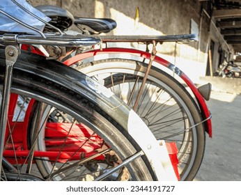 An old Dutch bicycle that is still well-maintained and usable. Old bicycle tires of a parked bicycle. Roadster bicycle, Camel, Buffalo. Selective focus.  - Shutterstock ID 2344191727