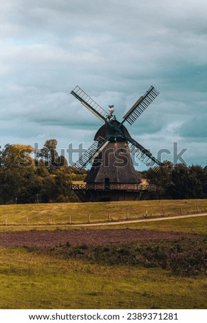 Old dutch windmill with blue sky located in Germany