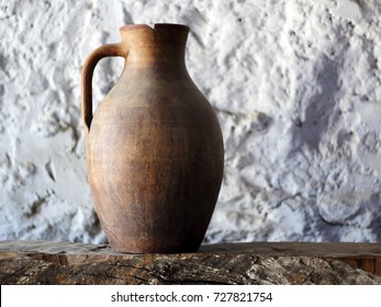 Old earthenware jug with crack - Shutterstock ID 727821754