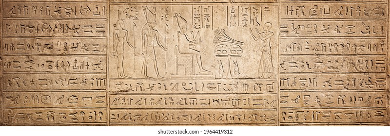 Old Egyptian hieroglyphs on an ancient background. Wide historical background. Ancient Egyptian hieroglyphs as a symbol of the history of the Earth.  - Shutterstock ID 1964419312