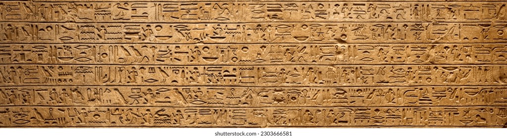 Old Egyptian hieroglyphs on an ancient background. Wide historical background. Ancient Egyptian hieroglyphs as a symbol of the history of the Earth.  - Shutterstock ID 2303666581