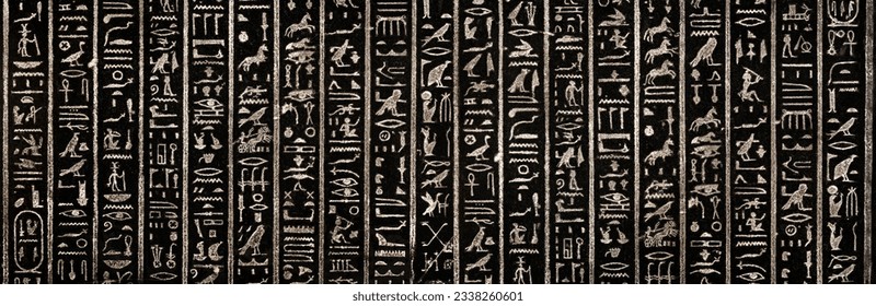Old Egyptian hieroglyphs on an ancient background. Wide historical and culture background. Ancient Egyptian hieroglyphs as a symbol of the history of the Earth. 