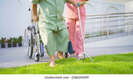 Old Elderly Asian Patient Or Pensioner People Walking By Walker With A Nurse, Relaxing, In Nursing Home In Garden Park. Senior Lifestyle Activity Recreation. Retirement. Health Care Physical Therapy.