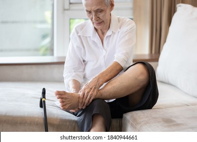 Old elderly with foot injuries,ankle bone diseases,heel pain or soles,asian senior woman suffering from peripheral neuropathy,beriberi,nerve inflammation of the foot, numbness of the feet and toe