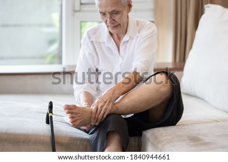 Old elderly with foot injuries,ankle bone diseases,heel pain or soles,asian senior woman suffering from peripheral neuropathy,beriberi,nerve inflammation of the foot, numbness of the feet and toe