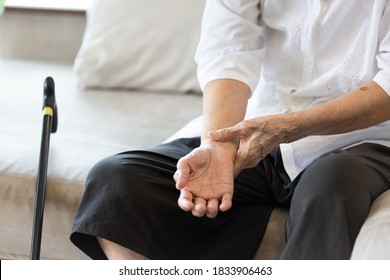 Old elderly people with wrist injury,bone pain in wrist,numbness or beriberi,asian senior woman suffering from De quervain's disease,weakness in hand,concept of arthritis,arthritic nerve,tendonitis