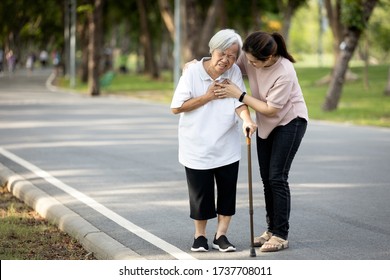 Old Elderly With Short Of Breath And Chest Pain From Heart Disease, Heart Attack Or Heart Failure While Walking To Exercise In Outdoor At The Park,senior Woman With Illness,symptoms Of Dyspnea,angina
