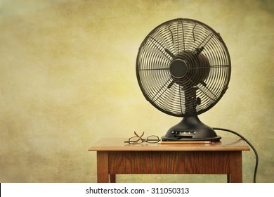 Old electric fan on table with retro look feeling