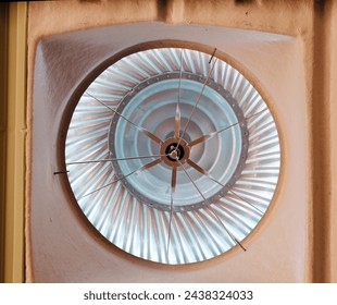 old electric fan on wall.