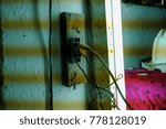 Old electric plug with lights and objects