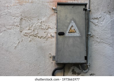 An Old Electrical Box Hung On The Wall