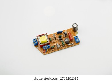 Old electronic component microcircuit chip closeup on white.