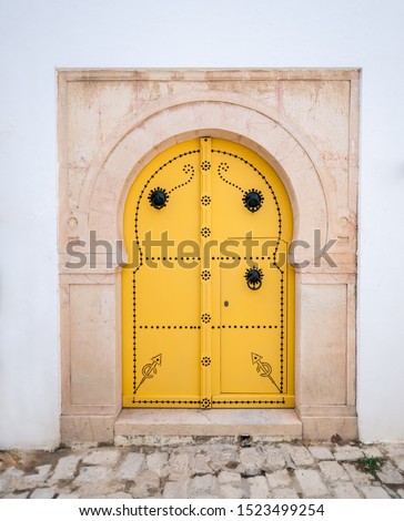 Old, elegant entrance to the house. Tunisian doors