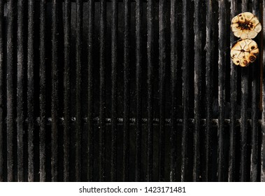 Old Empty Barbecue Grill Texture With A Thick Layer Of Soot And Carbon. Dirty Iron Bbq Lattice Background Top View With Place For Text. Dark Key Photo Template For Product Advertising