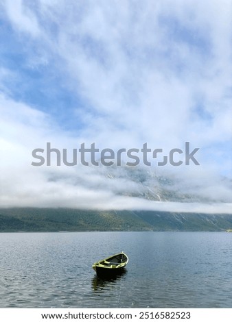 An old and empty row boat in Eikedalsvatnet, near Romsdal, in Norway