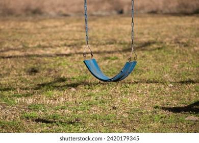 Old empty swing in yard