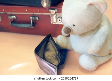 Old Empty Wallet, Teddy Bear Toy  And Vintage Suitcases. Bankruptcy Concept