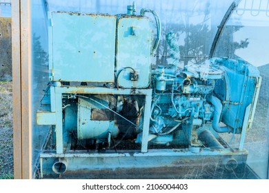 Old engine in glass display cases at maritime park in Pohang, South Korea.