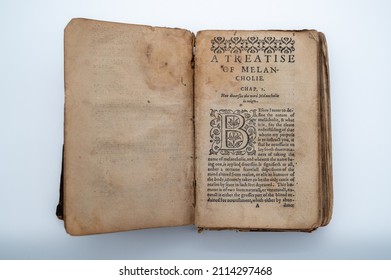 An Old English Book Sits Open To The Beginning Page Of The Book. A Treatise On Melancholie. The Pages Are Aged, Having A Brown Color. 