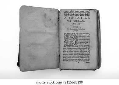 An Old English Book Sits Open To The Beginning Page Of The Book. A Treatise On Melancholie. The Pages Are Aged, Having A Brown Color.