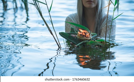 Old European Magic, Mystical Pagan Scene, Woman In Lake, Rituals. Magic Divination By Candle Of Wax On The Water, Ritual. Psychic Vision, Fortune Teller