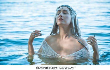 Old European magic, Mystical Pagan scene, woman in lake, rituals. Magic divination in water, ritual. 