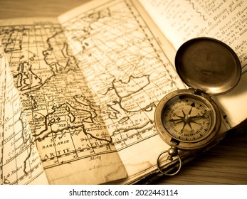 Old European Map And Antique Compass.