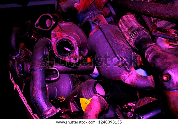 Old\
exhaust system. Metal recycling. Metal\
background.