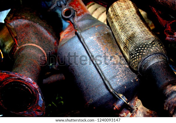 Old\
exhaust system. Metal recycling. Metal\
background.
