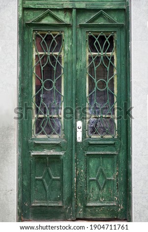 old exterior vintage wood green door with glass close-up