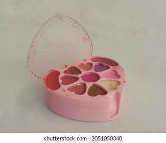 Old Eyeshadow Makeup Kit In A White Background. 