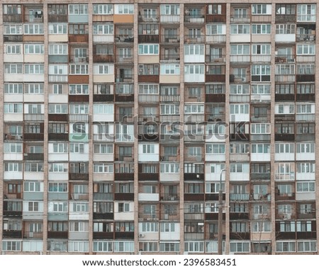 Old facades of brutalist soviet socialist buildings. The gloomy balconies of Russian flats.