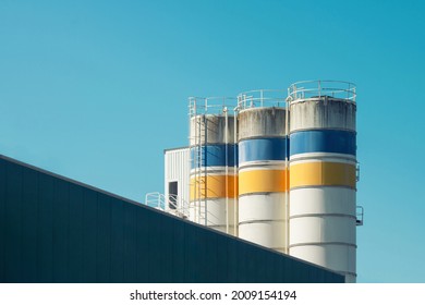 Old factory. Close up of storage tanks in a food factory. - Shutterstock ID 2009154194