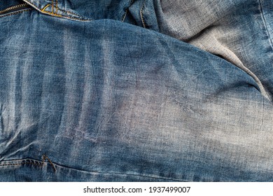 Old Faded Jeans Close-up. Jeans Background.