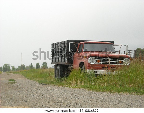 old family hauling truck, just sitting by the side
of the road