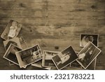 old family photographs, pictures from 30s - 40s in sepia color on wooden table, home archive documents, concept of family tree, genealogy, memories, memory of ancestors, family tree, nostalgia