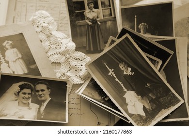 old family photos, pictures from 1935 in sepia color on wooden table, home archive documents, concept of family tree, genealogy, memories, memory of ancestors, family tree, nostalgia - Shutterstock ID 2160177863
