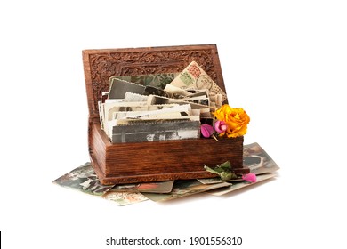 Old Family Photos Stacked In Wooden Box Isolated On White Background.