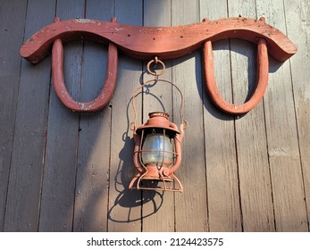 Old Farm House Antique Oil Lantern and Cow Yoke - Shutterstock ID 2124423575