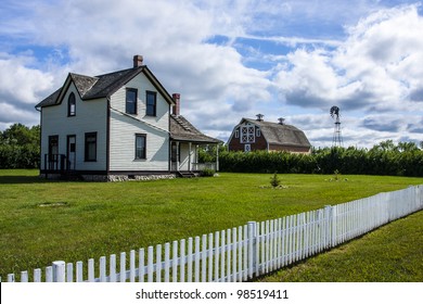 Old Farm Yard With The House And Red Barn