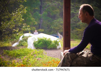 the old farmer is resting on the porch - Powered by Shutterstock