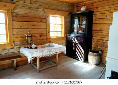 Old Farmhouse Kitchen Interior In Old Country House, Fireplace & Vintage Table. Ancient Kitchen. Living Room In Rustic Village Retro Style Farm Hut Home. Traditional Wooden Cottage Kitchen Interior