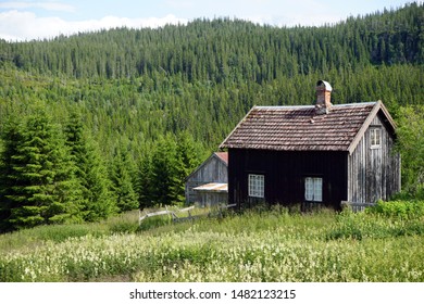 Old Farmhouse Near Forest In Norway